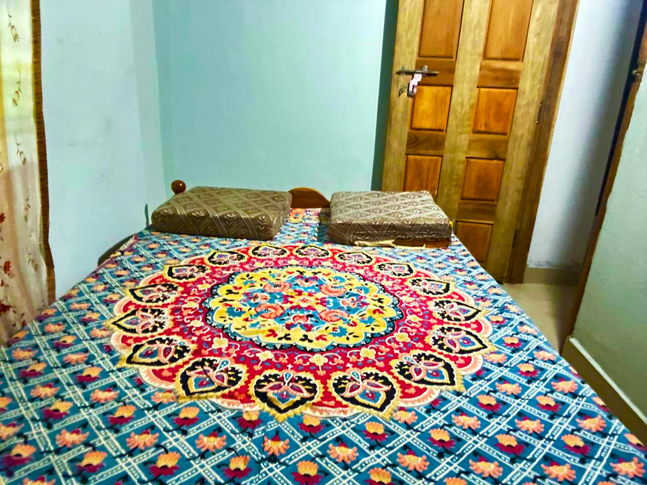 Colorful bedroom with patterned bedding